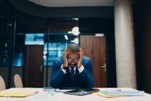 Concept economic sanctions, financial crisis and bankruptcy. Sad african american black Businessman